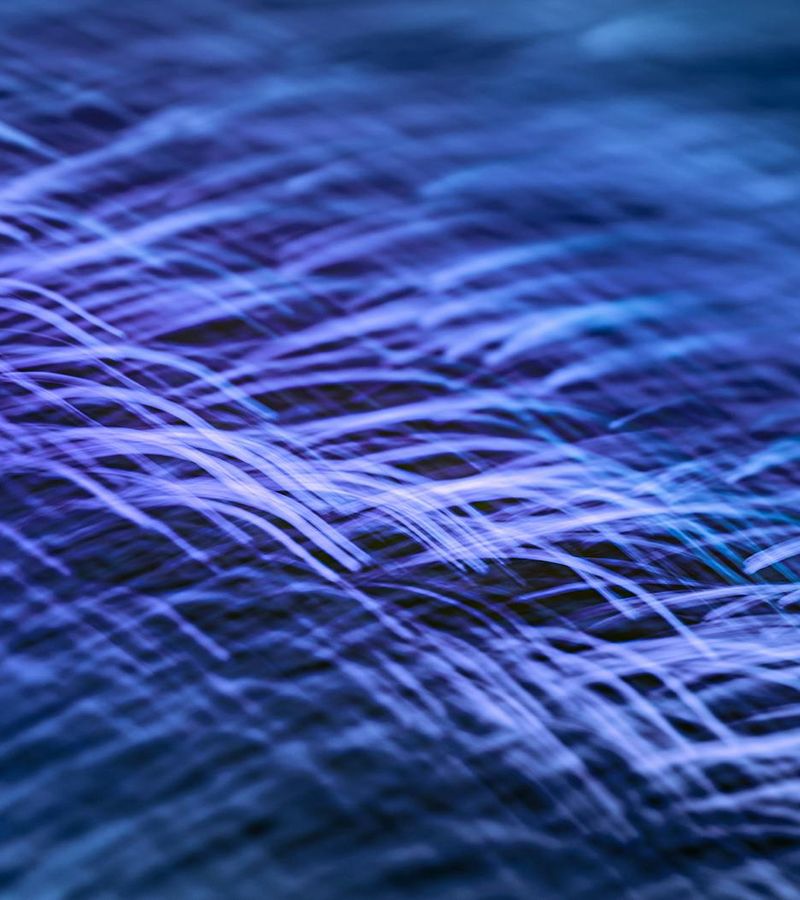 Abstract glowing blue lines in deep ocean space